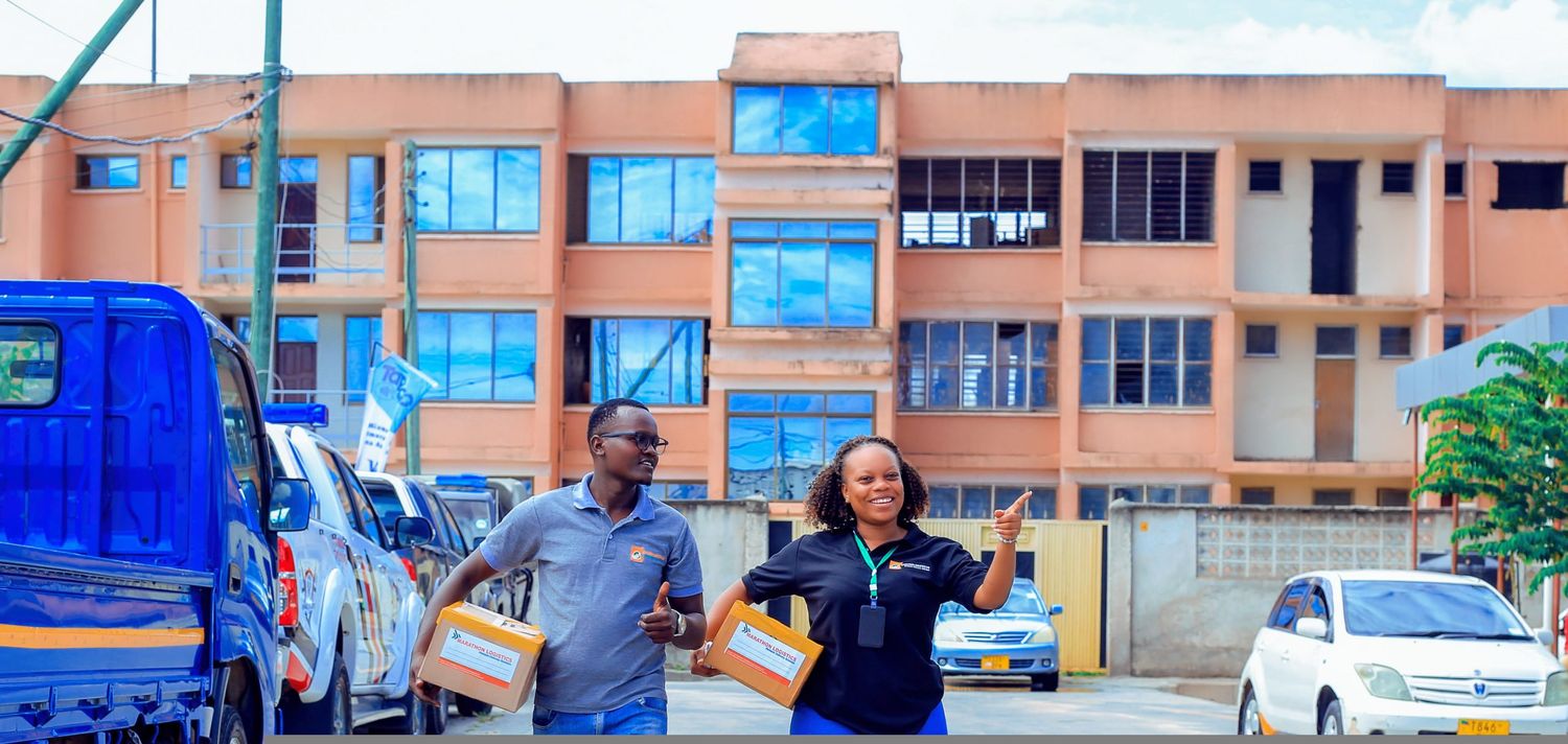 Staff carrying a batch of parcels out for distribution